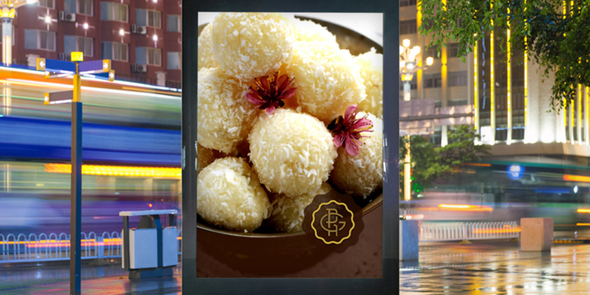 A billboard showing South Indian sweets and G Pulla Reddy logo design