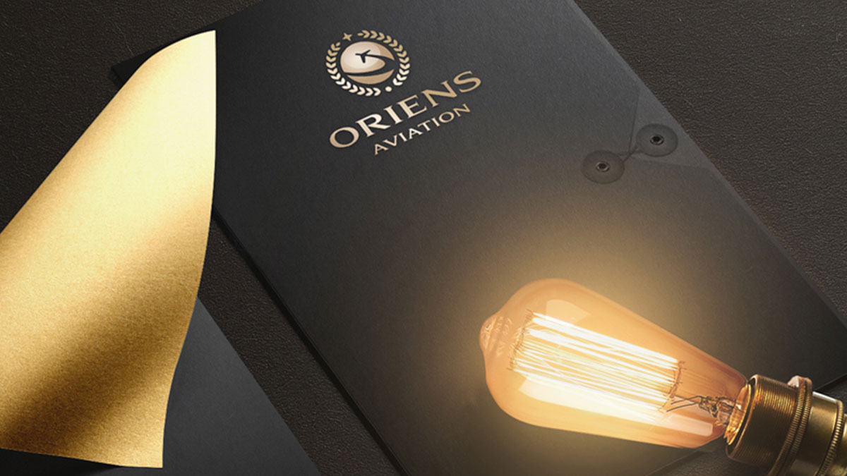 Oriens Aviation logo on a folder design