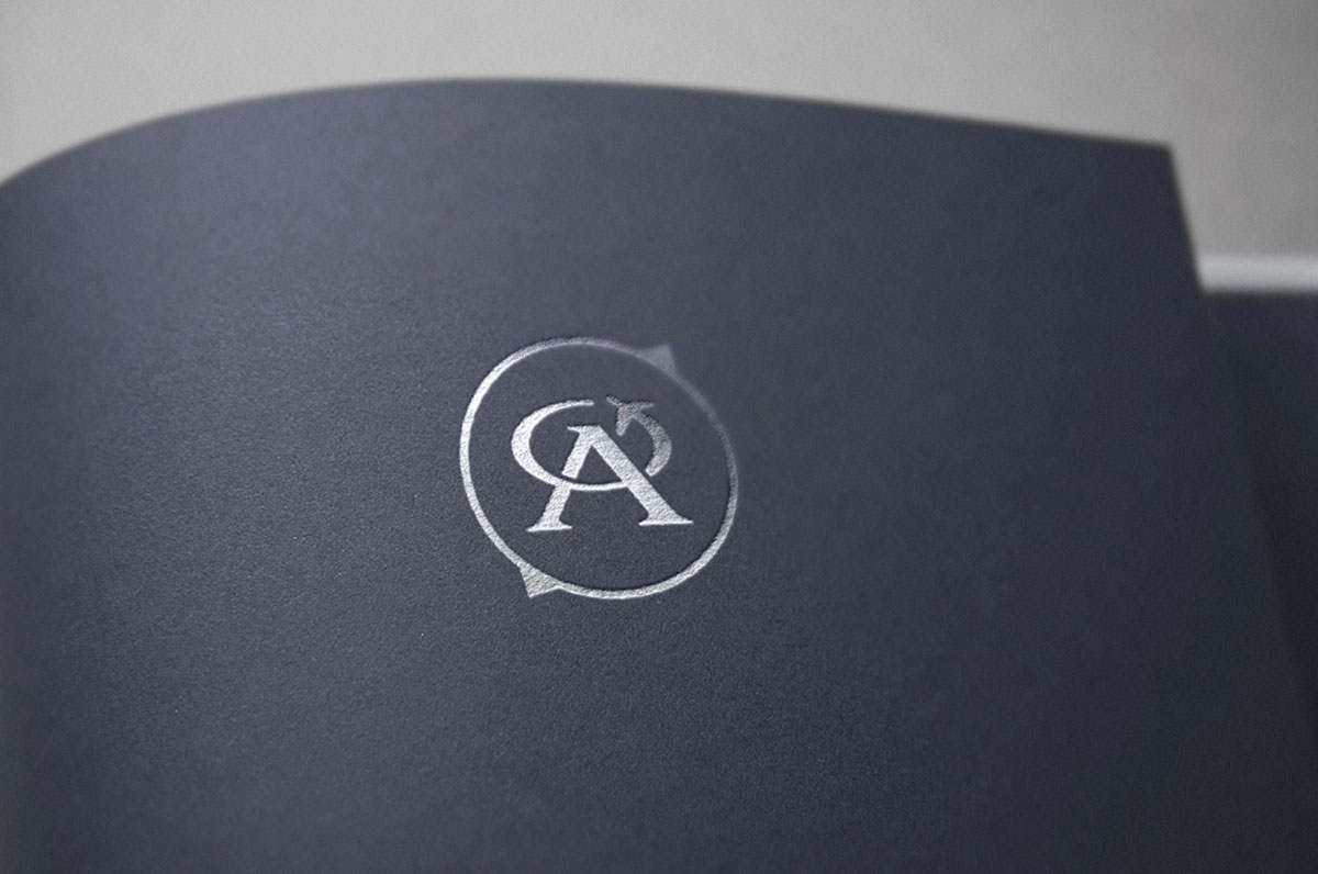 Oriens Aviation icon on a textured printed paper with silver foil