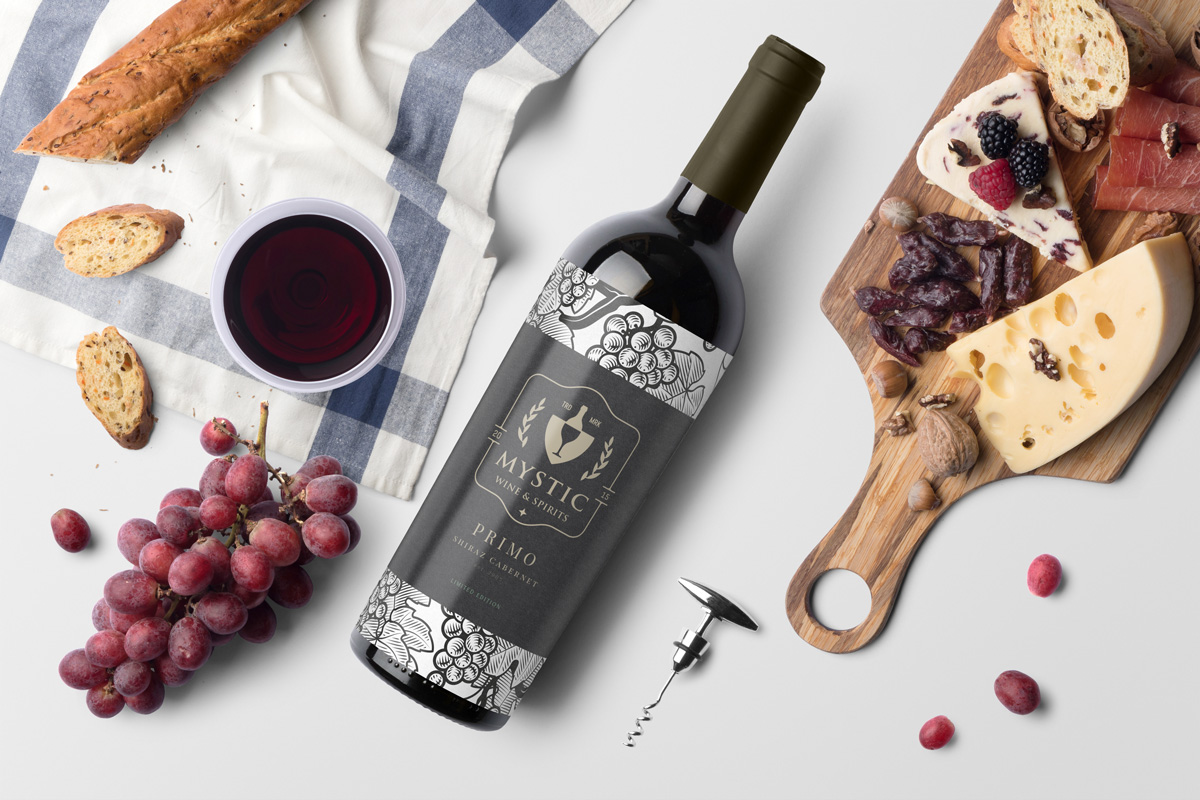 photo of mystic wine branding on bottle with bread and cheese platter