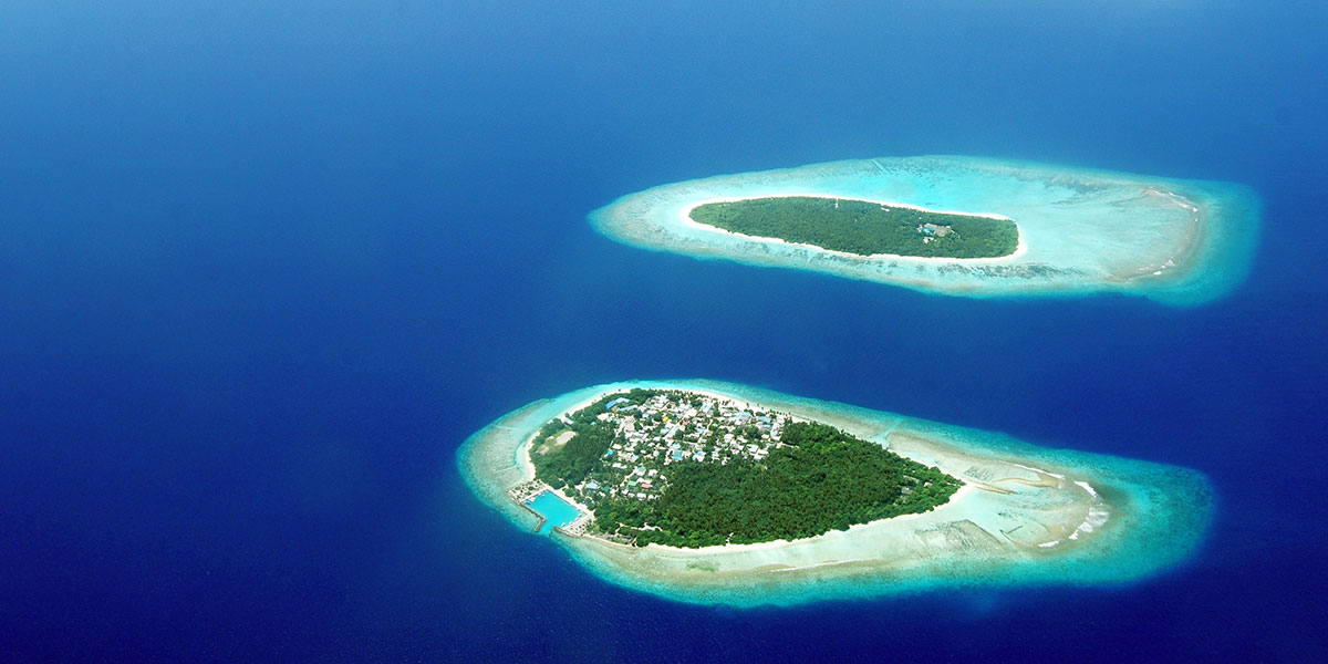 photos of two islands in Maldives taken from an aeroplane