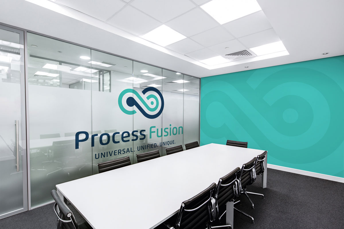 process fusion logo shown on the office walls inside a conference room