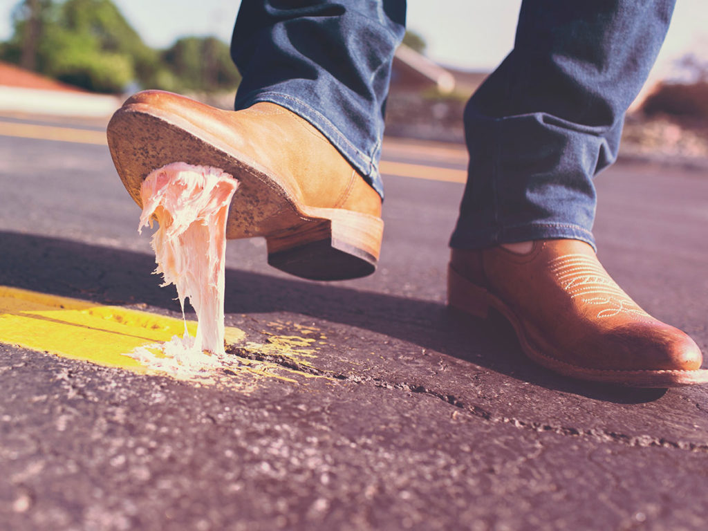 Digital Branding Mistakes represented by a shoe pulling gum stuck to the sole