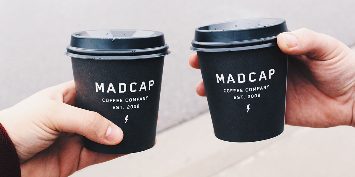 cohesive branding elements shown on coffee cups