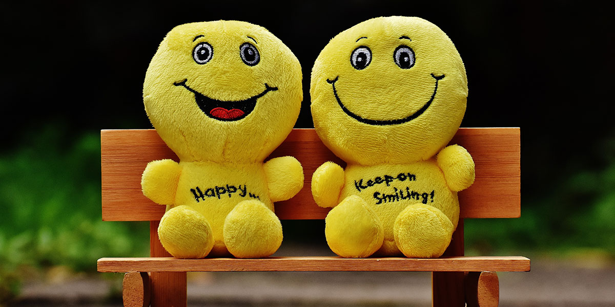 emotional branding shown with two fluffy toys with smiley faces