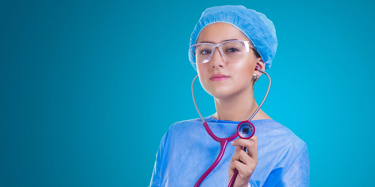 medical doctor with scrubs and holding stethoscope
