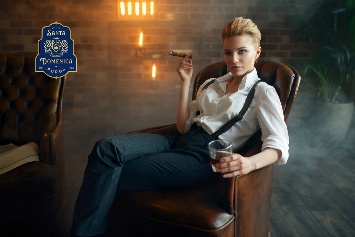 woman sitting in chair with whiskey and cigar